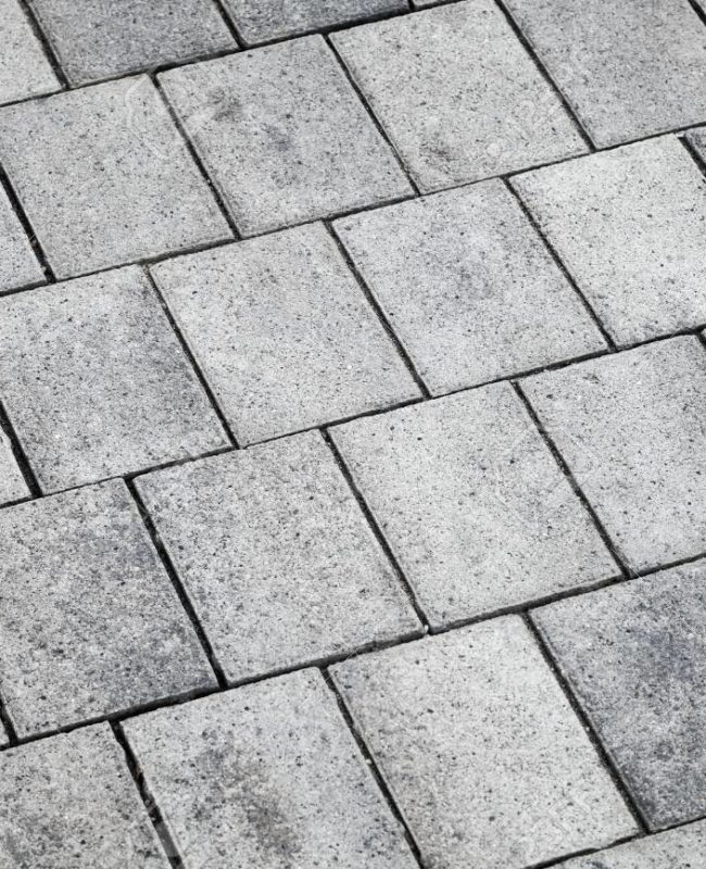 Gray concrete tiling, urban pavement, background texture